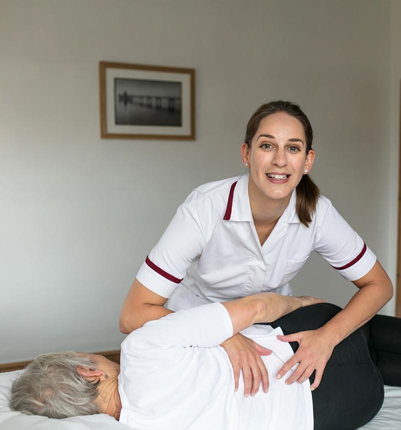 Lucy Smith, osteopath, with patient